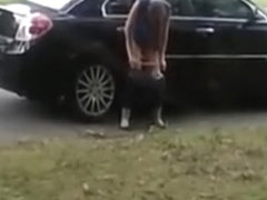 Totally drunk woman peeing on cars