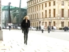 Blonde german lady in spandex uniform goes for a walk