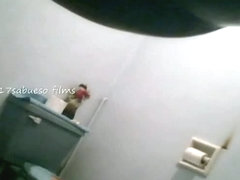 Pissing girls are filmed in the bathroom