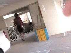 Asian babe unlocking her bike gets a skirt sharking.