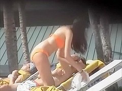 Spying on sultry Spanish darksome brown tanning her body topless