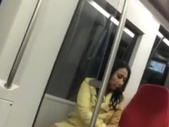 Sexy brunette upskirted in metro sairs