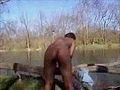 Ebony chick nude in the park