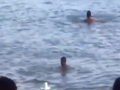 Crazy latin couple fucks in public in the sea with lots of spectators