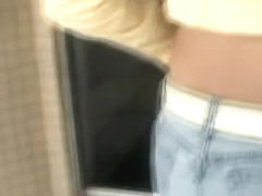 Candid ass wrapped in blue tight jeans caught in the street