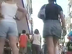 Summer girl with pony tails and jeans skirt voyeur video