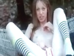 Russian cutie Gloria rubbing bald pussy outdoor