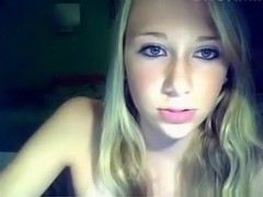Blonde girl with tanlines plays with her shaved pussy on a chair