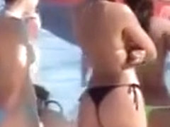 Latina babe with big booty wears a flimsy bikini bottom