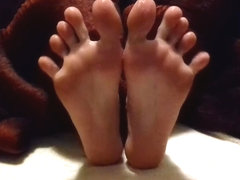 Lubed feet and soles rubbing each other - spreading toes