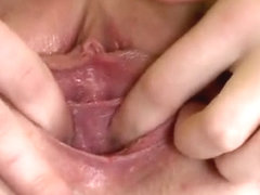 Sultry nympho is gaping soft cunt in closeup and having orga