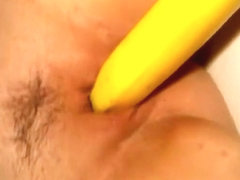 Yellow fruit in my wife's shaved wet tunnel of love