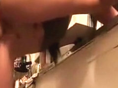 Brunette girl gets fucked doggystyle, while doing the dishes.