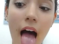 Beautiful Latina teen opens mouth, crosses eyes, and shows sexy feet