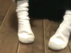 hot female wearing and playing in her long white gray toe and heel socks