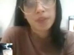 babe with glasses plays with pussy at work on camboozle.com