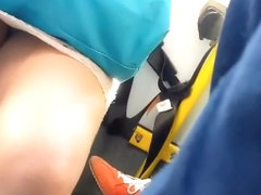 Peeping between commuter girl's legs