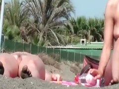 Nudist chicks in water and sunbathing
