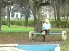 Spying Girl On Phone on Public Garden