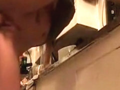 Brunette girl gets fucked doggystyle, while doing the dishes.