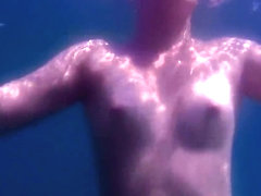 Teen Swimming Naked in the Sea Underwater