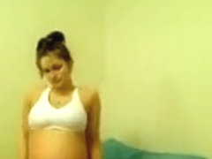 Young Pregnant Girl Does A Striptease