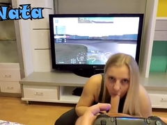 He plays GT Sport while she sucks his cock