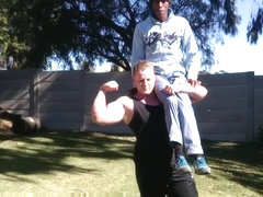 Giant man lift and carry smaller dudes