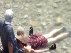 Voyeur captures a couple having sex in the sea