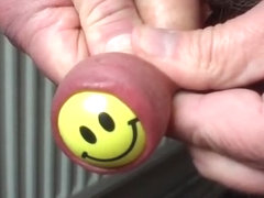 Foreskin with yellow smiley ball