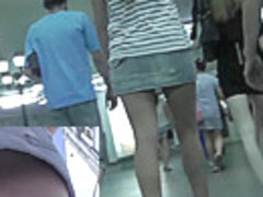 Blonde gal in a-line skirt captured on upskirt camera