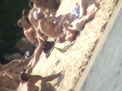 Naked tourists caught on beach spy cam relaxing and enjoying nudity