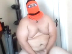 Muscular Chub in Ski Gear Strips and Jacks