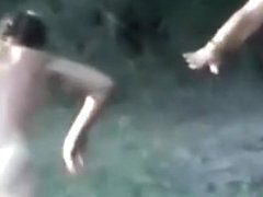 Voyeur tapes a slut having a threesome with 2 guys in the lake