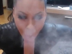 Smoking whore in latex giving bj