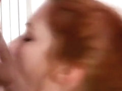 Redhead slaps her face with a big hard cock
