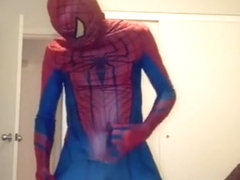 playing in Spiderman suit