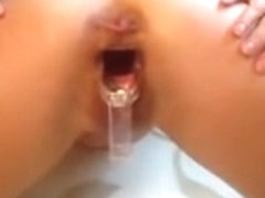 Wide open pussy with speculum