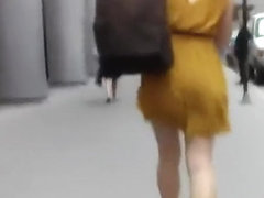 Woman in short yellow dress