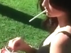Sexy brunette smoker gets outdoor