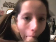 Ponytailed teen sucking cock