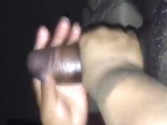 Jerking a big black cock until it cums really hard