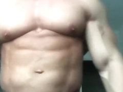 Huge Young Bodybuilder Posing and Flexing