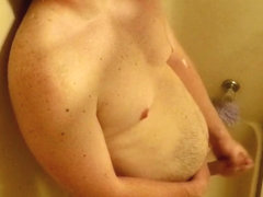 Horny daddy masturbating in the shower while home alone. Huge cum shot.