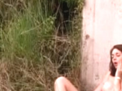 gal masturbating in the field