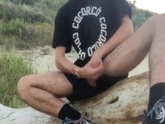 Hot Stud jerks off on a beach