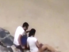 Italian lovers having missionary sex on the beach