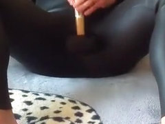 Hitting balls with rubber mallet in wetsuit