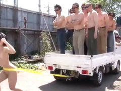 Fit Japanese girl flexes and shows off her strength outdoors