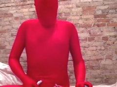 Zentai play in red with vibrator